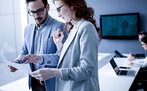 two people reviewing paperwork