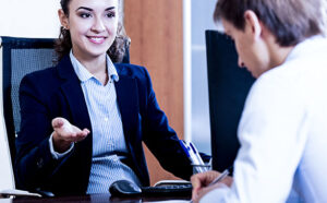 people talking at desk