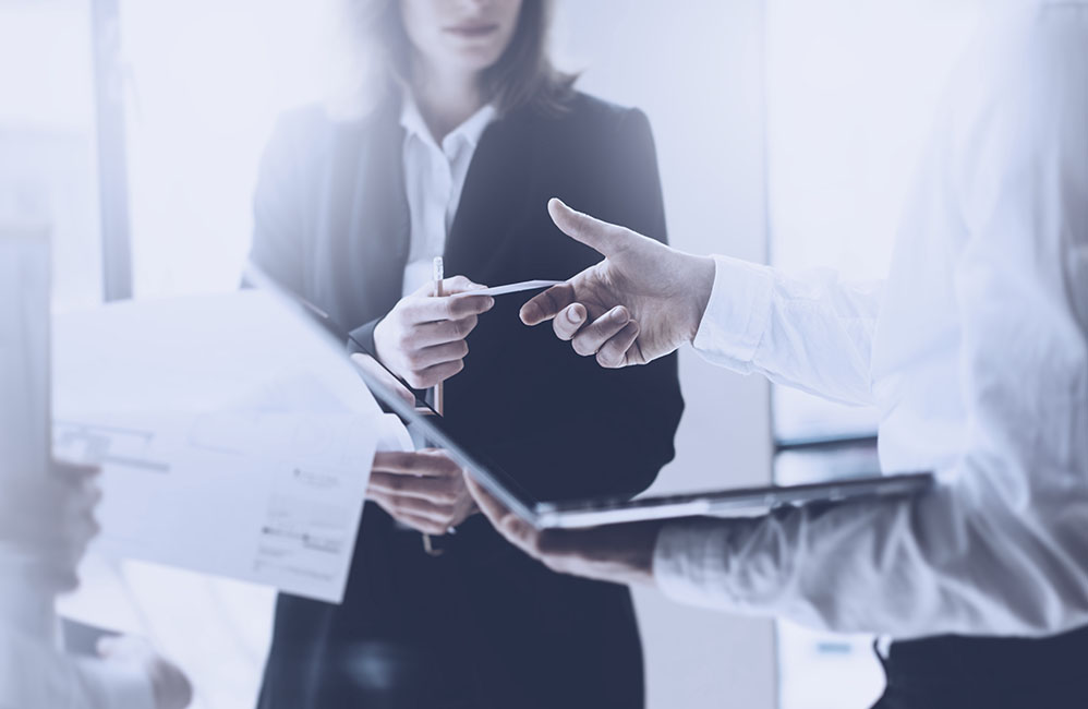 people looking at paperwork