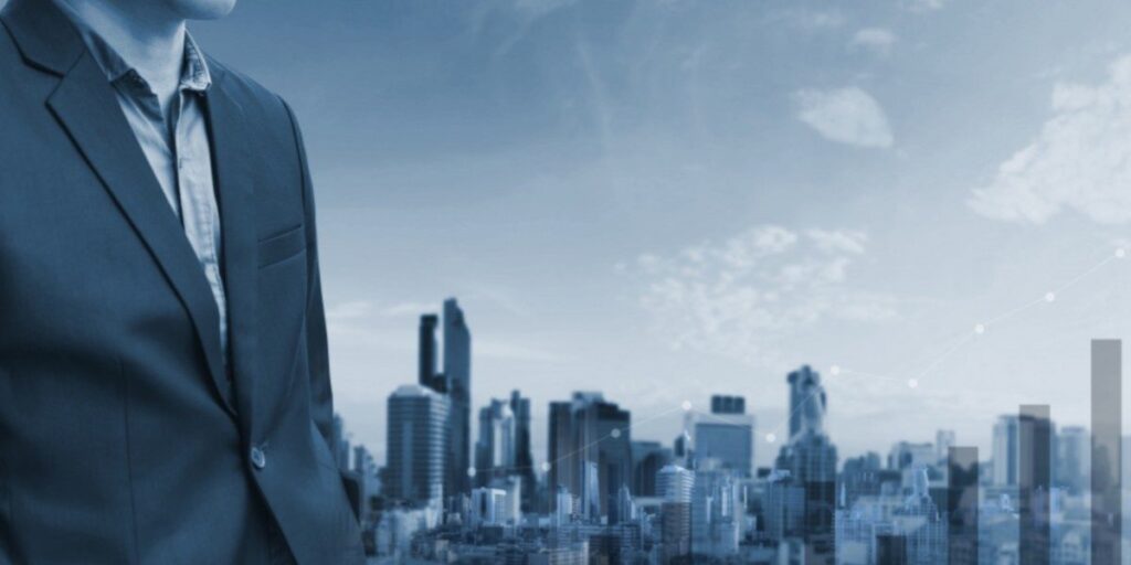 business man in front of skyline