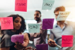 business people brainstorming with sticky notes