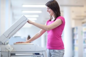 woman using copy machine