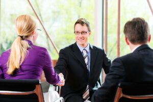 man shaking hands with employer